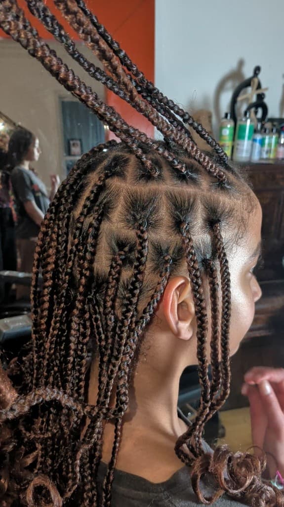 Box braids — side profile with copper extensions