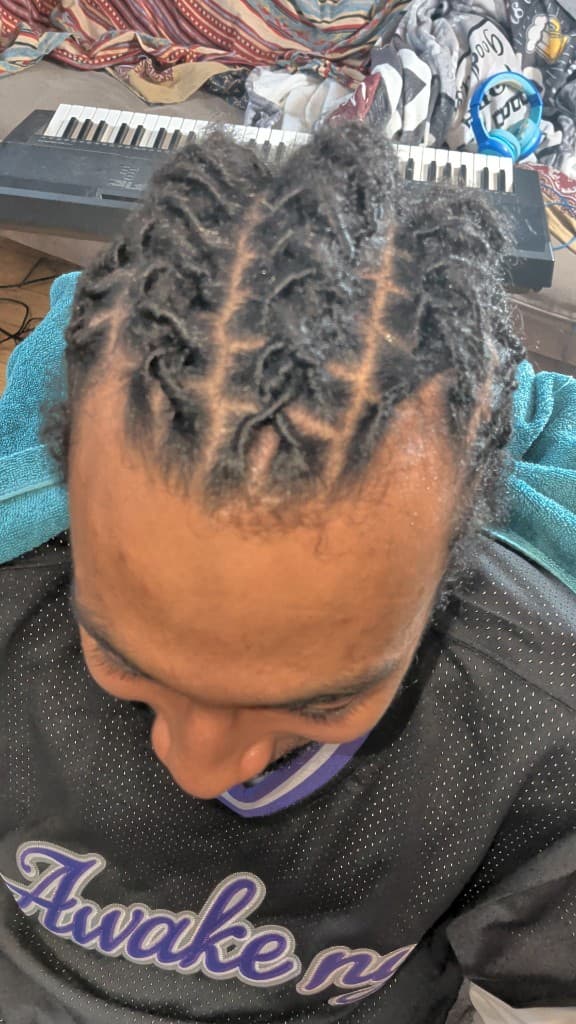 Fresh retwist with neat roots and styling