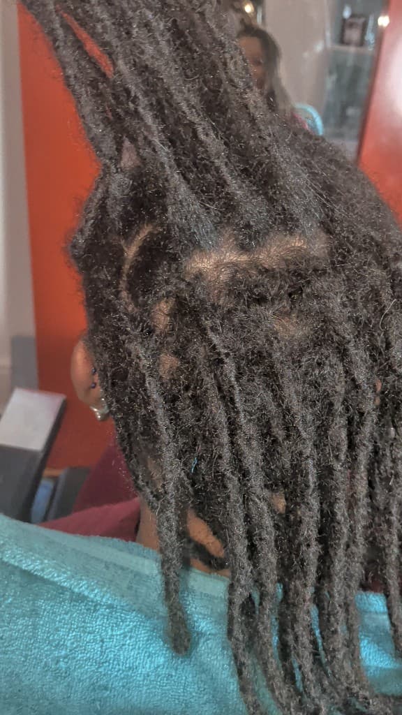 Traditional locs — half up with new growth