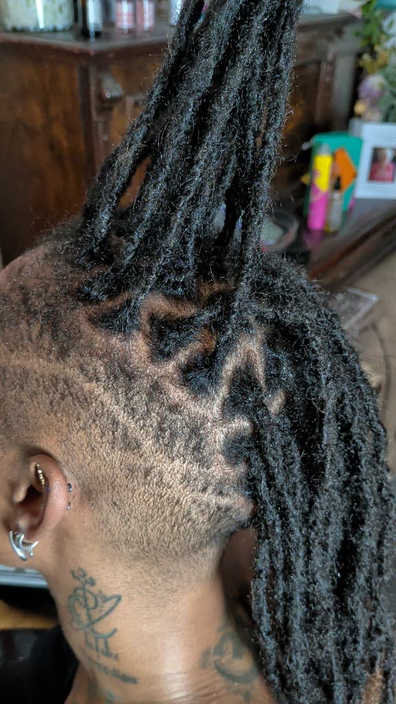 Traditional locs with undercut styling